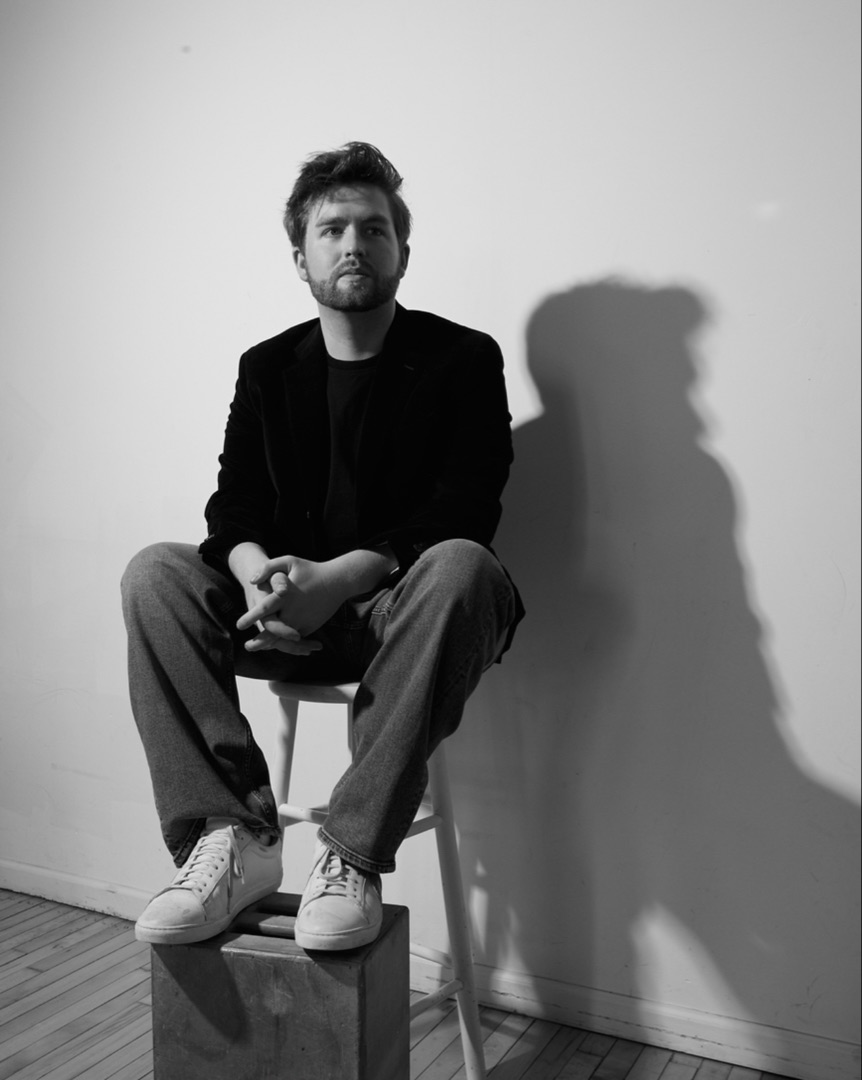 Patrick Brown — black and white, seated portrait