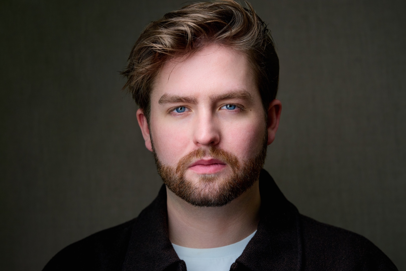 Patrick Brown headshot — intense look, dark jacket